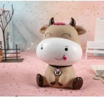 hucha vaca en escritorio