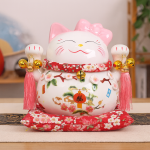 gato de la suerte japonés Maneki-Neko blanco con lazo rosa